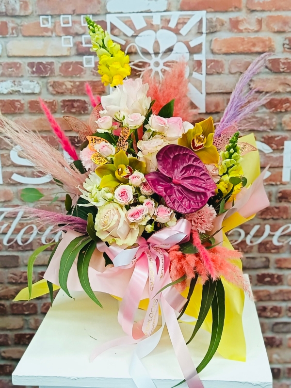Bouquet of red naomi roses, purple trachelium, viburnum snowball and deep pink Oriental Lilies, mixed with foliage