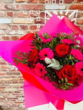  Six scented large headed red Roses with six pink gerbera, bound with foliage