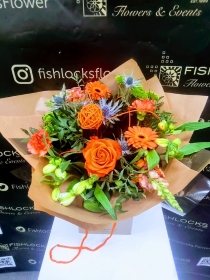 Bouquet of lime green chrysanthemum, shamrock bloom, green hypericum, with orange roses and gerbera