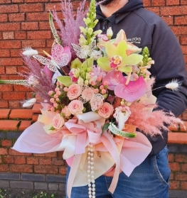 Bouquet of red naomi roses, purple trachelium, viburnum snowball and deep pink Oriental Lilies, mixed with foliage